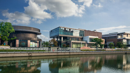 Contemporary Architectural Marvels by the Waterfront with Lush Greenery