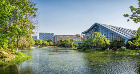 Obraz premium Urban Park Serenity Near Contemporary Buildings