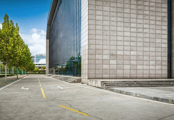 Sleek Glass Building Exterior with Reflective Windows and Trees