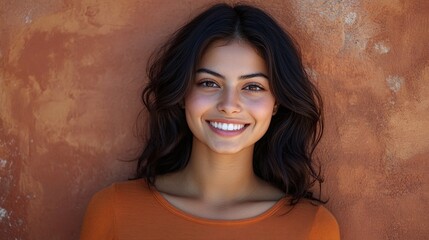Fototapeta premium smiling young woman looking confidently at the camera in an attractive portrait showing beauty and cheerful expression highlighting her natural look in a modern and stylish setting