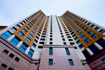 Looking up at some very tall buildings 