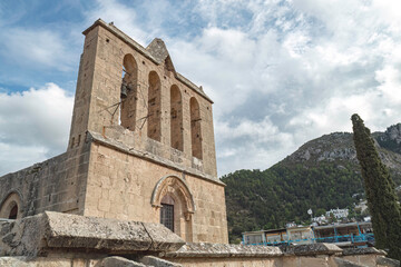 Bellapais Abbey showing its large belfry with three bells. Kyrenia District, Cyprus