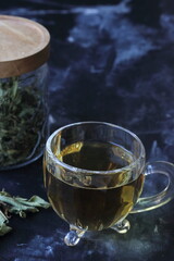 a jar, a cup of lemon balm tea, 