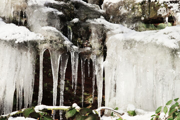 Icicles hanging from a rock