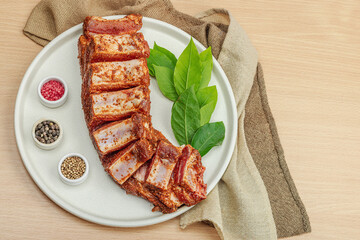 Marinated raw ribs with spices and herbs. Traditional ingredient for BBQ, picnic concept
