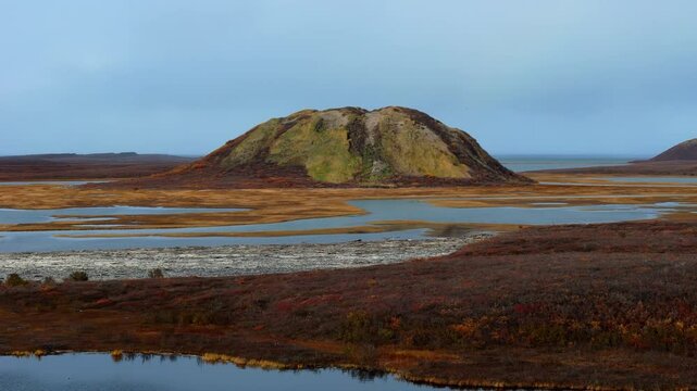 A View Of Soil Covered Hill Of Pingo National Landmark Near Tuktoyaktuk, Northwest Territories, Canada. Aerial Drone Shot