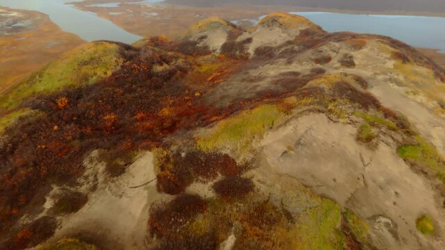 A Scenic Glimpse of Pingo Landmark, a Prominent Geographical Feature Located Near the Community of Tuktoyaktuk in the Northwest Territories (NWT), Canada - Aerial Pullback Shot