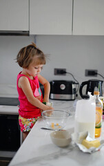 KId girl cooking