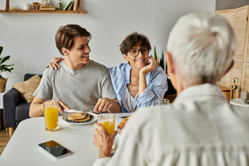 A joyful morning as a loving LGBTQ family shares breakfast and cherished moments together.