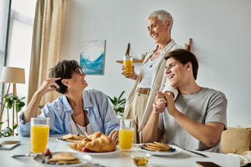 Three family members share laughter and delicious breakfast in a sunlit, welcoming kitchen.