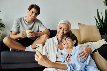 Fototapeta premium Three family members share laughter and joy while capturing a fun moment together.