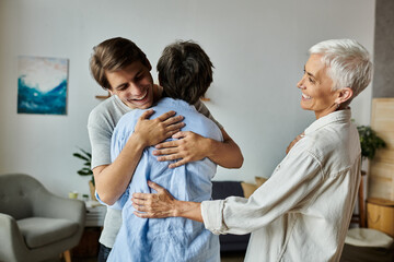 Lesbian parents and their adult son share a joyful embrace, celebrating love and family bonds.