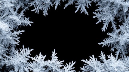 Frosty pattern frame on a black background. Winter overlay design with place for text. Frost on the glass, freezing effect. Christmas crystals concept copy space banner.