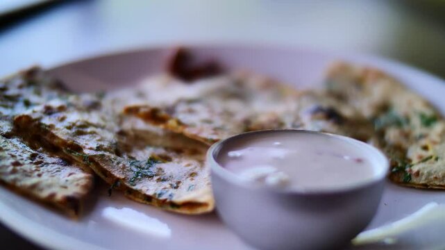 Indian paratha with herbs and yogurt