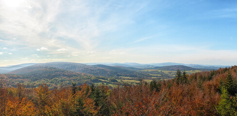 Fototapeta premium Picturesque panorama of the Low Beskid Mountains on a sunny autumn day from the top of the observation tower on Mount Ferdel