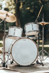 Obraz premium White Drum Set On Stage, Ready For A Music Performance. Musical Instrument, Concert Preparation.
