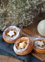 Traditional Christmas mince pies with dried fruits on a decorated table. English festive dessert.