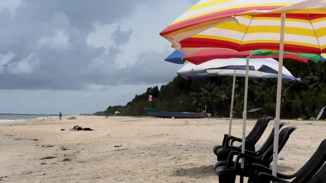 Colorful umbrellas set up for tourists at Marari Beach at Alappuzha, Kerala, India