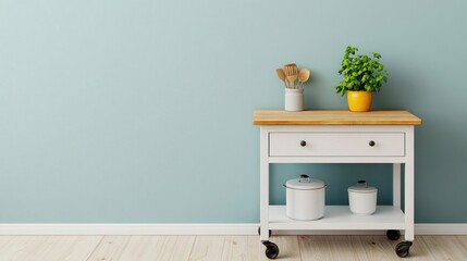 White Kitchen Cart with Green Plant and Wooden Utensils.