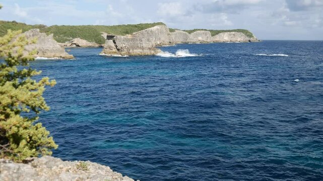 The cliffs and landscape of coast in Caye Plate, Marie Galante, lesser antilles island in Guadeloupe archipelago, short 4k video