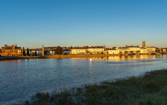 Town of Barnstaple by sunset, view of river Taw, clock tower and The Holy Trinity Church