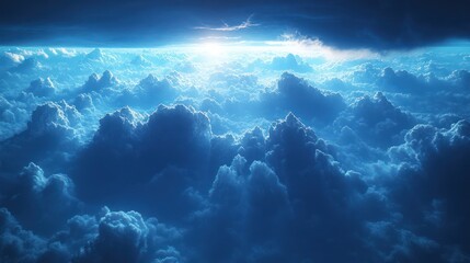Dramatic aerial view of a sea of clouds with a ray of light breaking through the darkness.