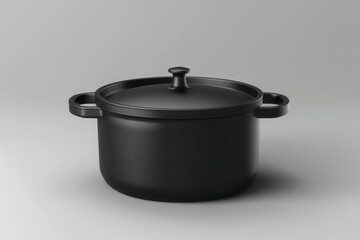 Simple black cooking pot on a light gray background in a minimalist design