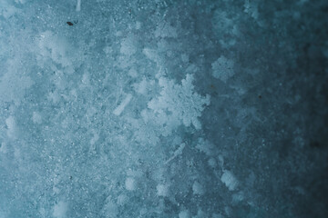 Macro picture of snowflakes with crystals in good view. Snowflakes on snow. Christmas and winter background. Natural snowdrift close up photo.