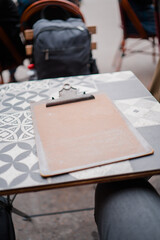 Empty Clip Board Lying on a Table with Patterns