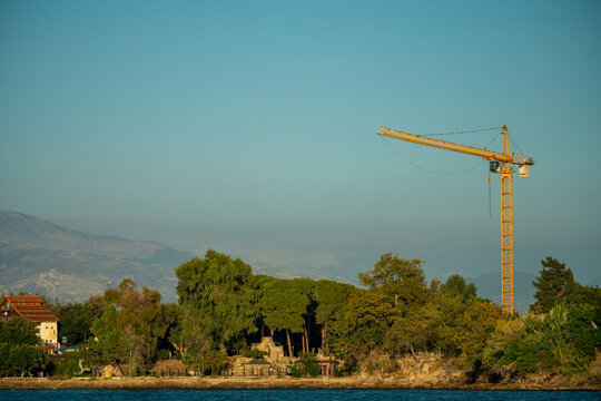 construction crane next to the sea
