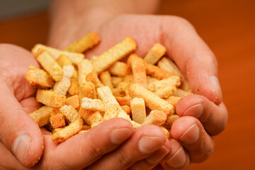 Fast food. Snack. Cholesterol. Fast carbohydrates. Salty snack for beer. Unhealthy food. Croutons. Unhealthy food for figure, heart, skin, teeth. Junk food.