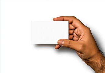 Fototapeta premium A close-up image of a human hand holding a blank white card against a plain white background, illustrating simplicity, potential, and presentation concepts.