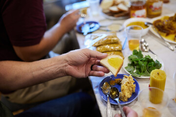 People sit at the table and eat honey, cake and drink honey drink.