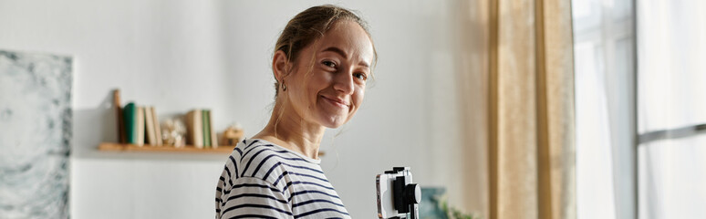 A joyful woman with vitiligo beams while capturing her charming surroundings.