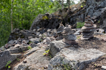Stone cairns stand on rocky ground of former marble quarry