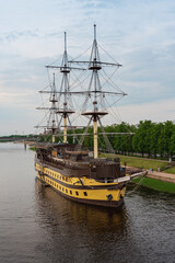 A wooden frigate on the Volkhov River in Veliky Novgorod. A three-decked merchant ship of the time of Peter I.