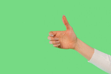 A cheerful hand gestures a thumbs up against a vibrant green backdrop, celebrating positivity and encouragement