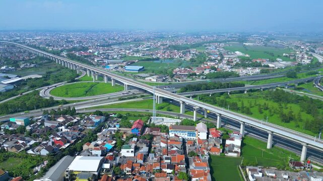 Title	
Established Aerial View of Pasir Koja Interchange, the meeting point of Soroja Toll Road, Purbaleunyi Toll Road and Jakarta-Bandung High Speed ​​Rail Line, Bandung, Indonesia