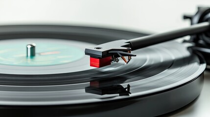 Close-up of a retro-inspired turntable, with the needle gently resting on a spinning record, set against a clean white backdrop, perfect for music enthusiasts.