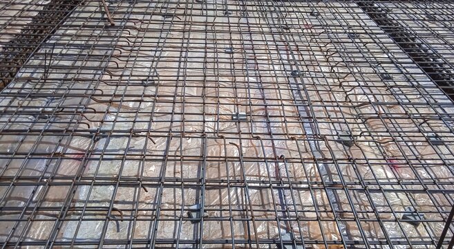 Iron fittings on wooden form work for house floor with concrete slab