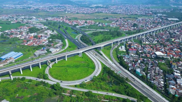 Title	
Established Aerial View of Pasir Koja Interchange, the meeting point of Soroja Toll Road, Purbaleunyi Toll Road and Jakarta-Bandung High Speed ​​Rail Line, Bandung, Indonesia