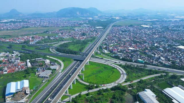 Title	
Established Aerial View of Pasir Koja Interchange, the meeting point of Soroja Toll Road, Purbaleunyi Toll Road and Jakarta-Bandung High Speed ​​Rail Line, Bandung, Indonesia