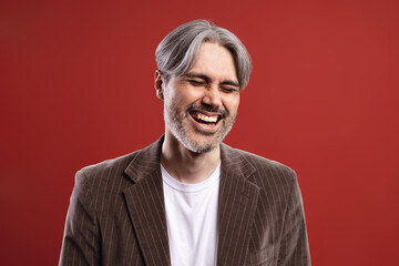 man smiling with eyes closed