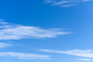 Serene Blue Sky with Wispy White Clouds on a Sunny Day