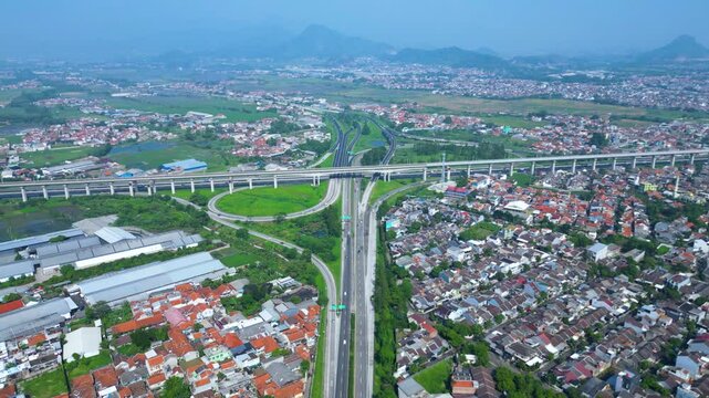 Established Aerial View of Pasir Koja Interchange, the meeting point of Soroja Toll Road, Purbaleunyi Toll Road and Jakarta-Bandung High Speed ​​Rail Line, Bandung, Indonesia