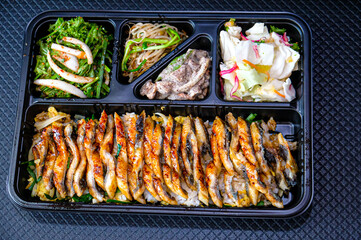 a bowl of rice topped with eel. korea food