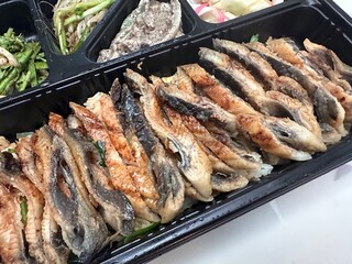 a bowl of rice topped with eel. korea food