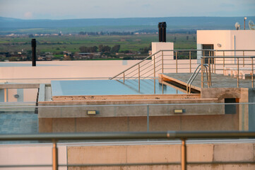 Fototapeta premium Rooftop pool in a residential complex in summer in Cyprus