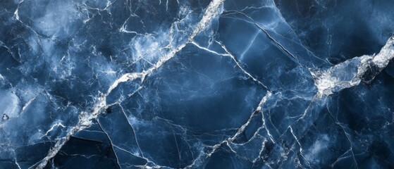 A blue and white marble wall with cracks and holes