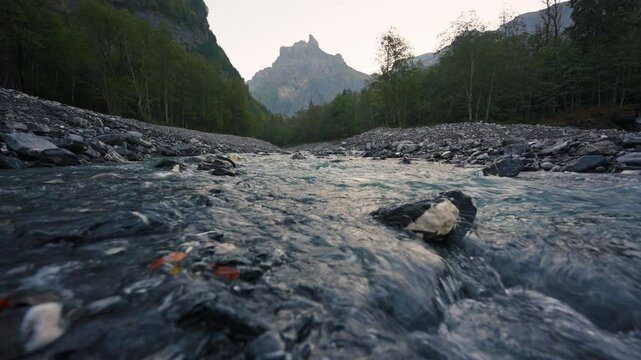 Landscape of Cirque du Fer a Cheval with river flowing in the valley at Sixt Fer a Cheval, France